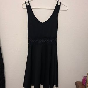 Black strap dress with lace in the middle